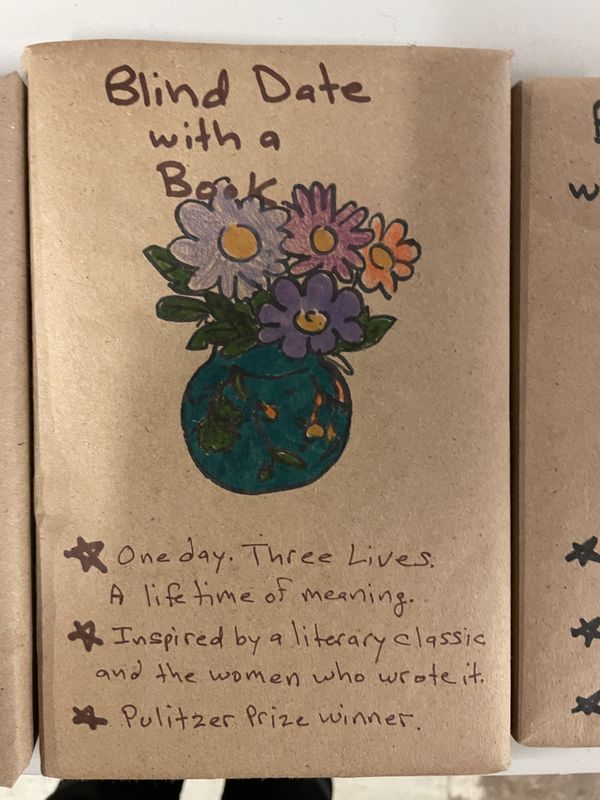A hand-drawn wrapped book showing flowers in a vase, with hints about a Pulitzer Prize winner.